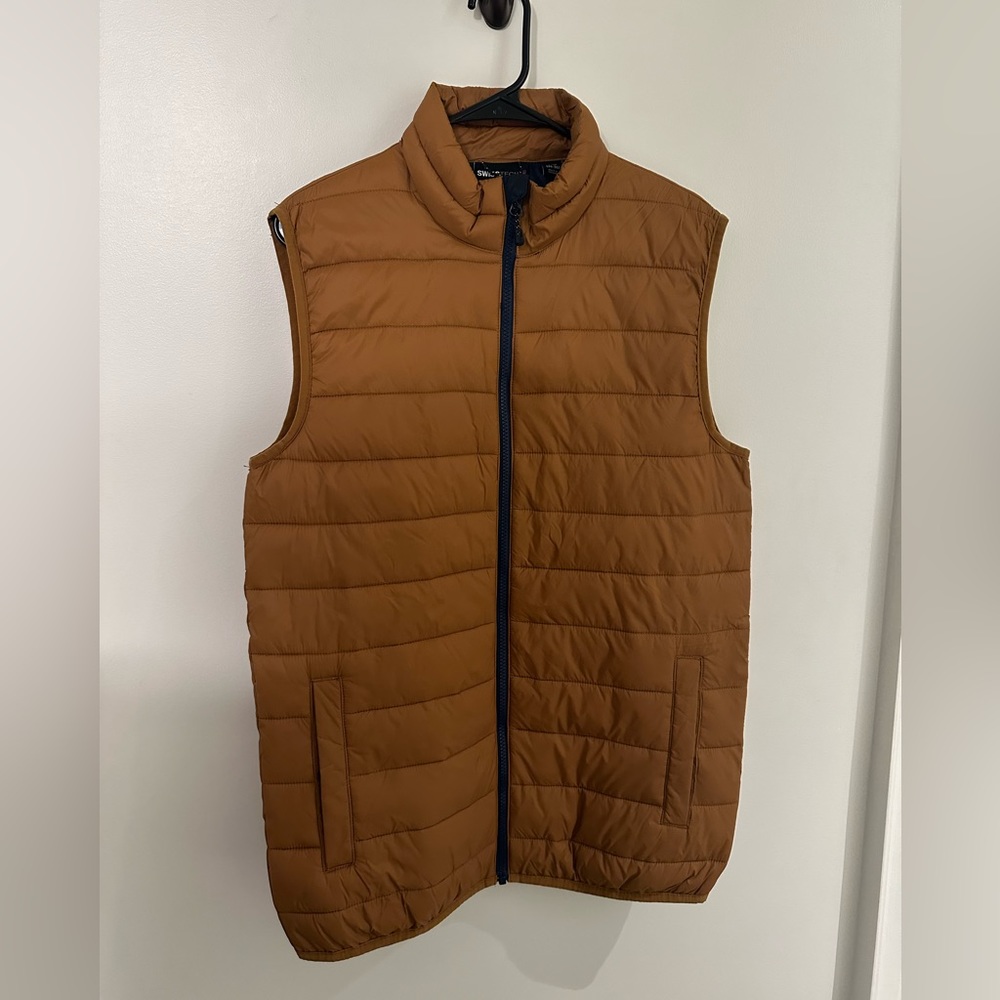 Small brown Alpine Swiss Tech vest